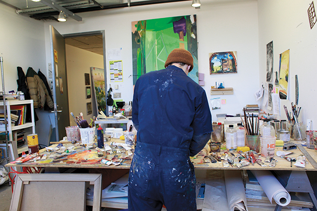 Student working on a project and their back is facing the camera