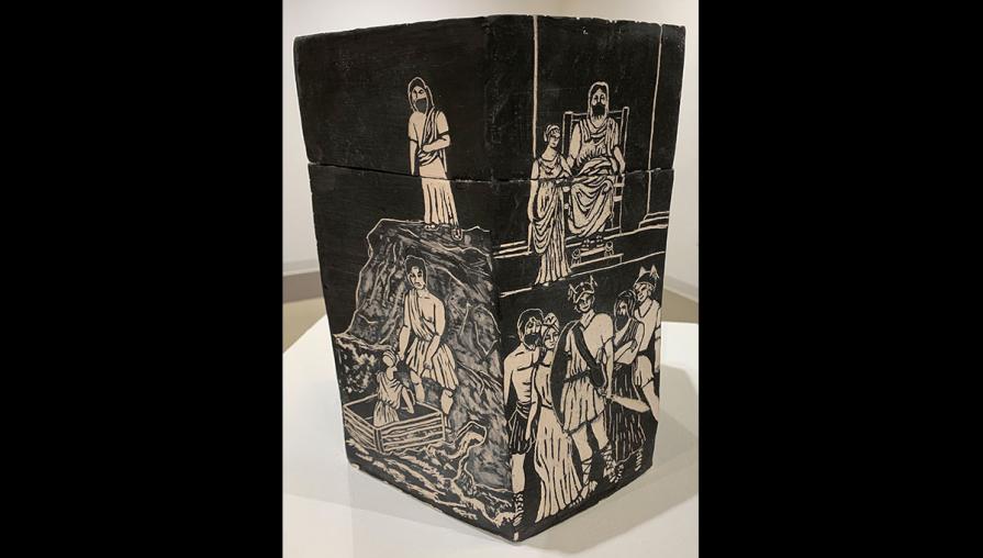 a box ceramic using sgraffito to carve the story of Perseus with black slip and white clay underneath