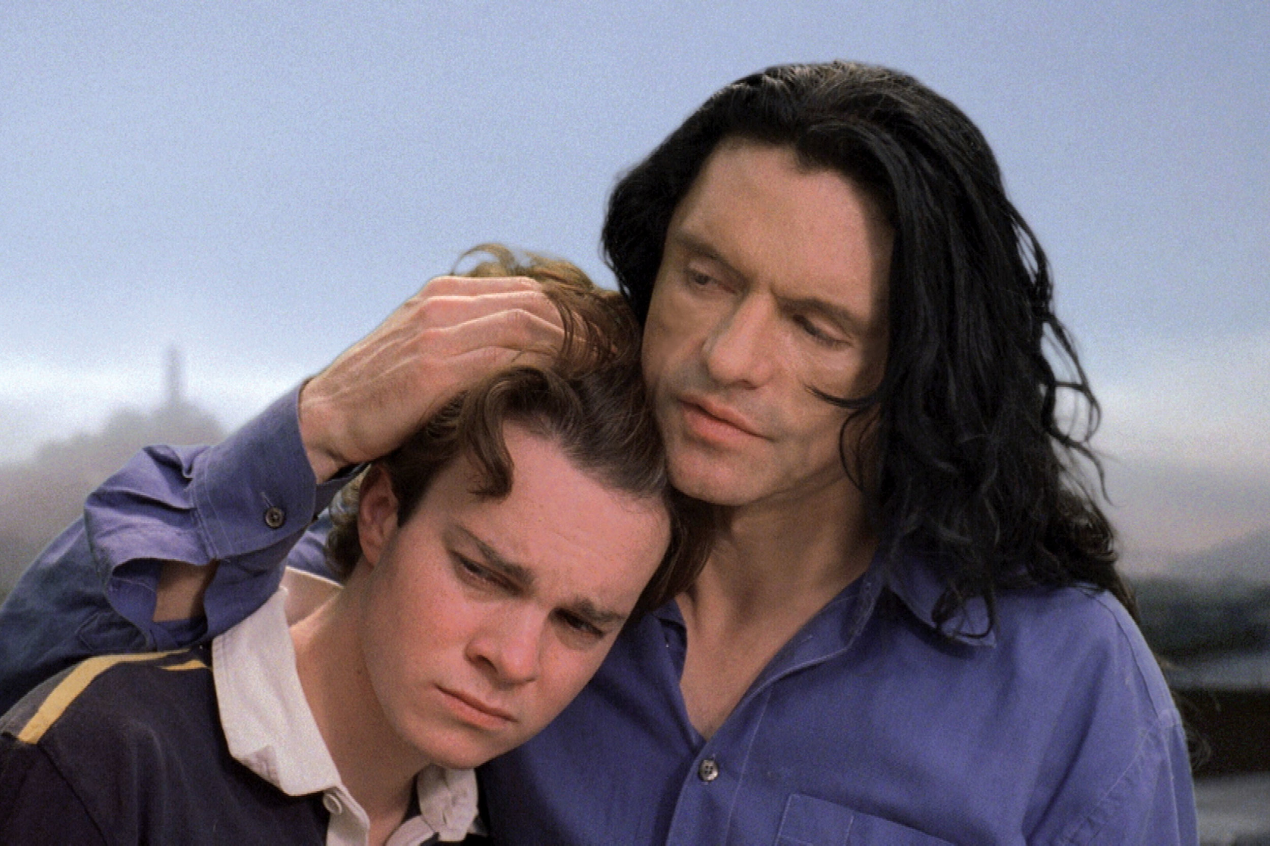 wiseau hugging child