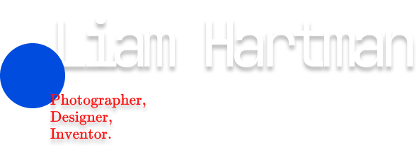 logo header liam hartman with blue circle