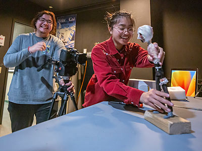 Students photographing paper model