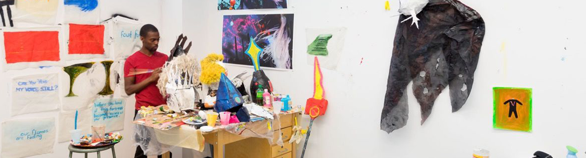 African American Yale Art School student in a studio working on an art piece.