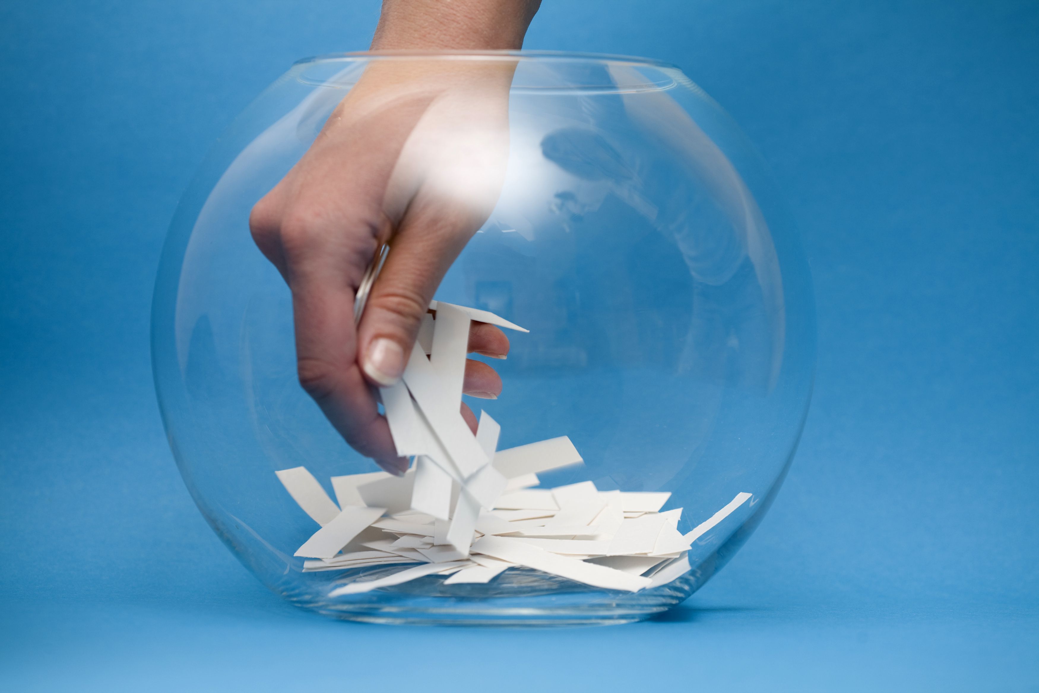 hand in a glass bowl