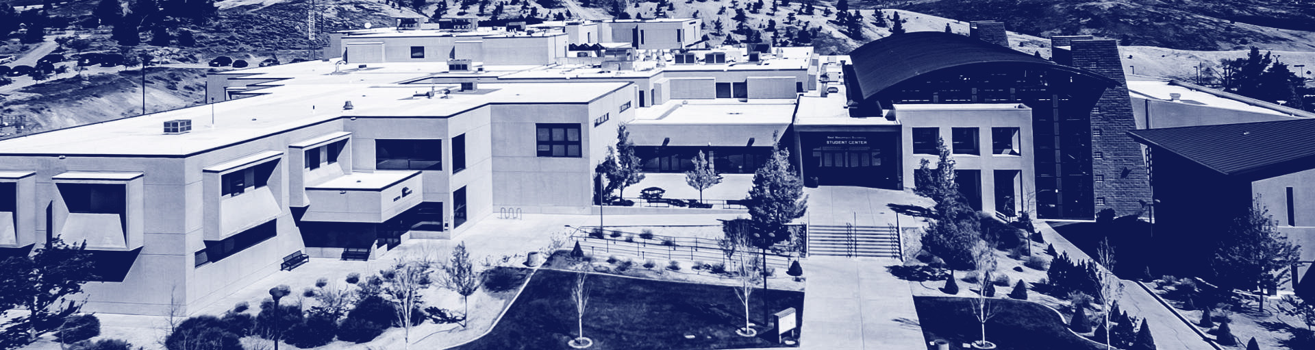 blue and white image of the TMCC red mountain building, shot from above